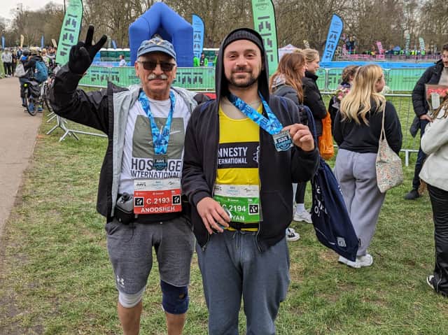 Anoosheh Ashoori (left) and his son Aryan (right) after completing the Cambridge Half Marathon