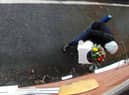 Owner Kim Hughes was left “mortified” when she watched back the footage and saw the hooded man walking off with the box filled with letters to dead relatives. 