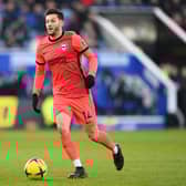 Adam Lallana of Brighton & Hove Albion runs with the ball during the Premier League match  (Photo by Michael Regan/Getty Images)