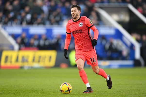Adam Lallana of Brighton & Hove Albion runs with the ball during the Premier League match  (Photo by Michael Regan/Getty Images)