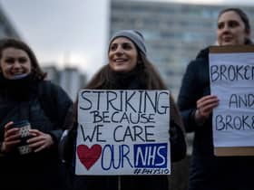 NHS physiotherapists take part in a strike outside of St Thomas’ Hospital on January. (Photo by Carl Court/Getty Images)