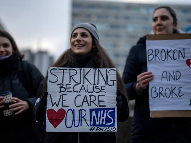 NHS physiotherapists take part in a strike outside of St Thomas’ Hospital on January. (Photo by Carl Court/Getty Images)