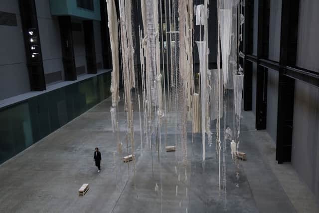 A gallery assistant looks at the latest Hyundai Commission for Tate Modern’s Turbine Hall by Chilean artist Cecilia Vicuna in October.(Picture: Isabel Infantes/AFP via Getty Images)