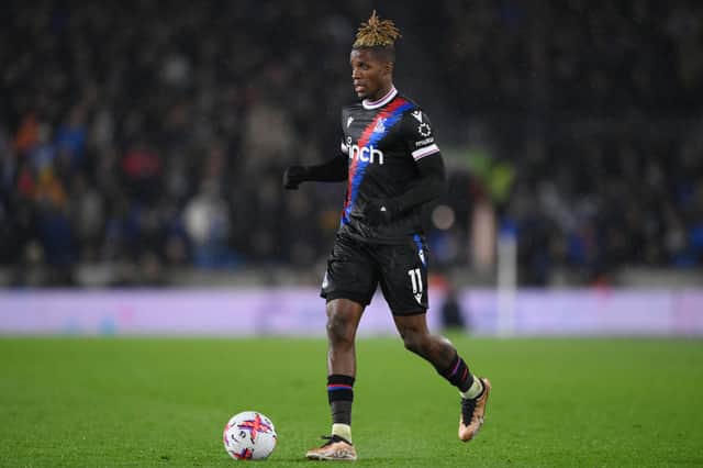 Wilfried Zaha of Crystal Palace runs with the ball during the Premier League match (Photo by Justin Setterfield/Getty Images)