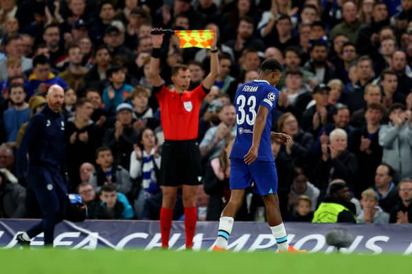 Wesley Fofana of Chelsea leaves the pitch due to an injury during the UEFA Champions League group (Photo by Catherine Ivill/Getty Images)