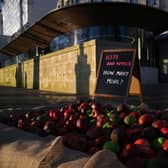 In January, 1,071 mock rotten apples were left outside New Scotland Yard, the headquarters of the Metropolitan Police force. (Photo by Daniel Leal/AFP via Getty Images)