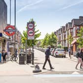 Pedestrians cross the road outside Tooting Bec station. Credit: TfL