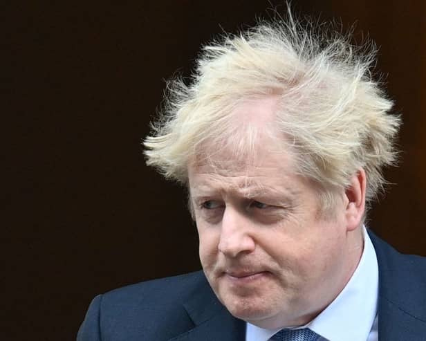 Boris Johnson leaves from 10 Downing Street in February  2022. (Photo by JUSTIN TALLIS/AFP via Getty Images)