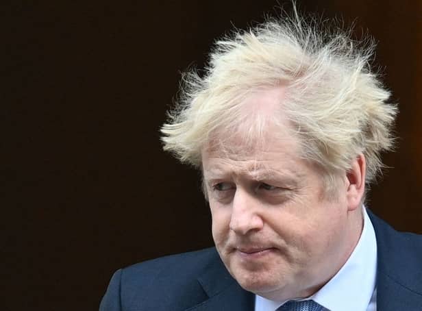 Boris Johnson leaves from 10 Downing Street in February  2022. (Photo by JUSTIN TALLIS/AFP via Getty Images)