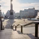One of London’s most famous sites, Trafalgar Square here is almost empty, save for one person taking a photo in the plaza.