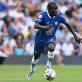 Chelsea’s French midfielder N’Golo Kante runs with the ball during the English Premier League football match  (Photo by GLYN KIRK/AFP via Getty Images)