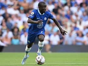 Chelsea’s French midfielder N’Golo Kante runs with the ball during the English Premier League football match  (Photo by GLYN KIRK/AFP via Getty Images)