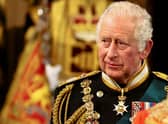 King Charles III gives recipients their honour or award in a special ceremony