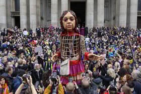 Little Amal is a giant puppet of a 10-year-old Syrian refugee girl. Credit: Getty Images