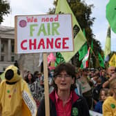 Demonstrators hold placards during an Extinction Rebellion march in London.