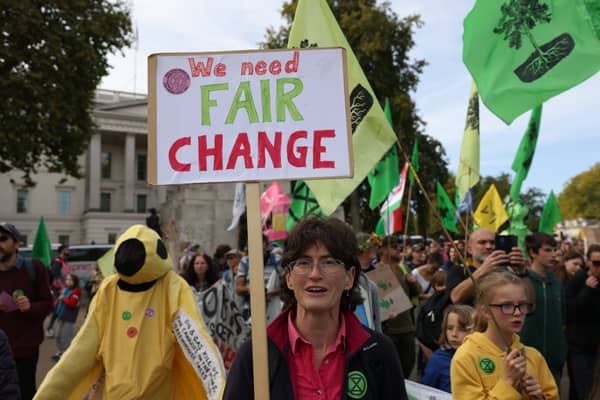 Demonstrators hold placards during an Extinction Rebellion march in London.