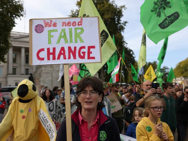 Demonstrators hold placards during an Extinction Rebellion march in London.