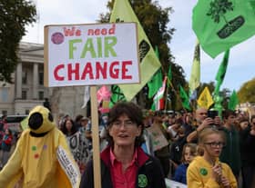 Demonstrators hold placards during an Extinction Rebellion march in London.