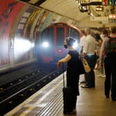 Commuters waiting for an underground train in London.