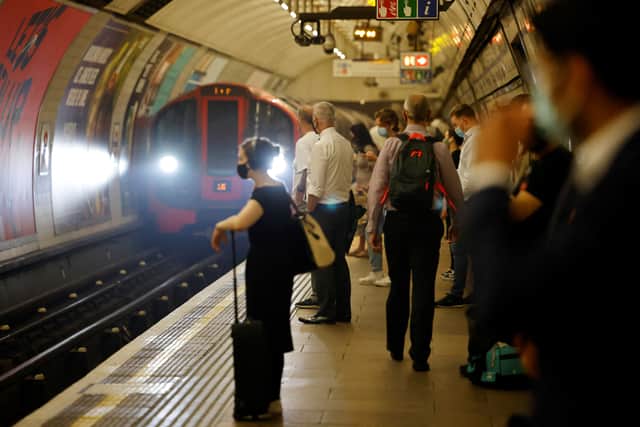 Commuters waiting for an underground train in London.