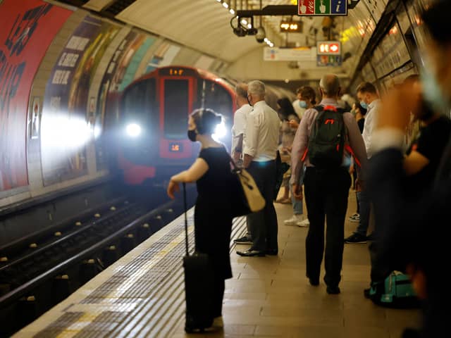 Commuters waiting for an underground train in London.