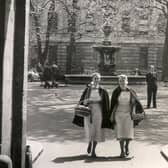  Two nurses walking through the archway of the North Wing, May 22 1954