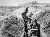 28th October 1914:  British soldiers lined up in a narrow trench during World War I.  (Photo by Hulton Archive/Getty Images)