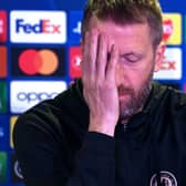 Graham Potter gestures as he attends a press conference at Stamford Bridge in London (Photo by GLYN KIRK/AFP via Getty Images)