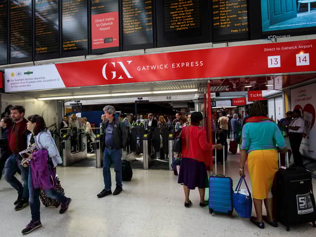 Passengers at the Gatwick Express in Victoria Station.  (Photo by Jack Taylor/Getty Images)