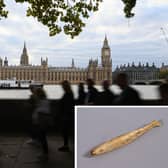 A carved fish, possibly a gaming counter, was found in the earth under the House of Lords’ Royal Court. (Photo by Alain Jocard /AFP via Getty Images/Parliament)