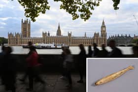 A carved fish, possibly a gaming counter, was found in the earth under the House of Lords’ Royal Court. (Photo by Alain Jocard /AFP via Getty Images/Parliament)