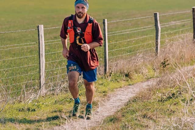 Tom Hooker is fundraising for Brain Tumour Research by running 60 km to the Emirates Stadium.