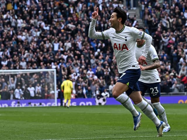 Tottenham Hotspur's South Korean striker Son Heung-Min (C) celebrates after scoring the opening goal (Photo by BEN STANSALL/AFP via Getty Images)