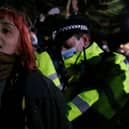 A woman is arrested during a vigil for Sarah Everard on Clapham Common on 13 March, 2021, in London, United Kingdom. Credit: Getty Images.