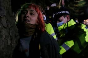 A woman is arrested during a vigil for Sarah Everard on Clapham Common on 13 March, 2021, in London, United Kingdom. Credit: Getty Images.