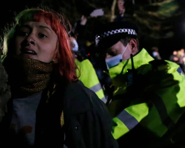 A woman is arrested during a vigil for Sarah Everard on Clapham Common on 13 March, 2021, in London, United Kingdom. Credit: Getty Images.