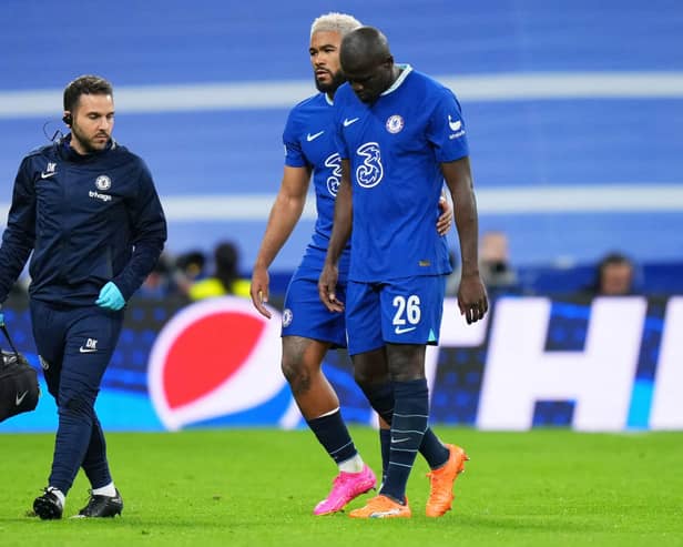 Kalidou Koulibaly of Chelsea leaves the field, whilst being consoled by Reece James, after receiving medical  (Photo by Angel Martinez/Getty Images)