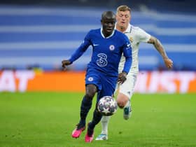 Ngolo Kante of Chelsea runs with the ball whilst under pressure from Toni Kroos of Real Madrid  (Photo by Angel Martinez/Getty Images)