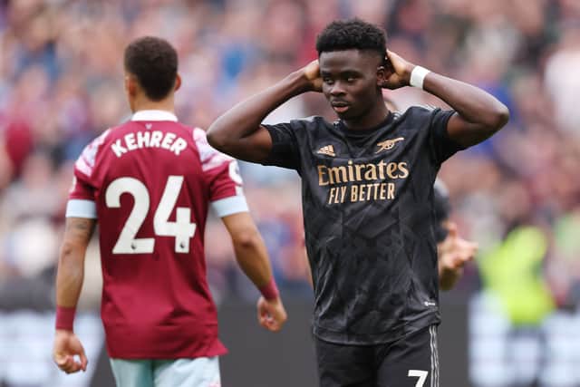 Bukayo Saka of Arsenal reacts after missing a penalty against West Ham