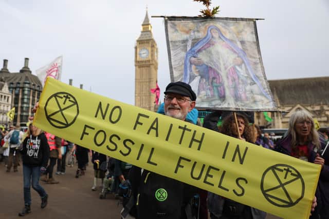 An Extinction Rebellion demonstrator in Parliament Square. Credit: Hollie Adams/Getty Images.