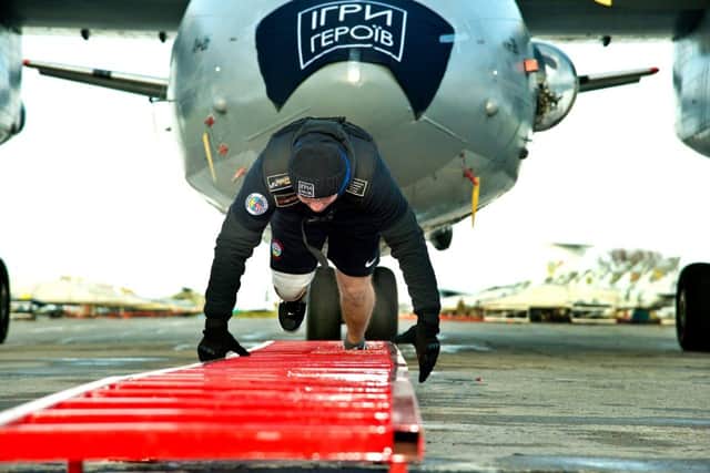 The sportsman set a record for a person with a disability pulling an Antonov An-26 airplane. Credit: Citizen/ctzn24.com