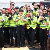 Britain’s Mo Farah is applauded at his final London Marathon by members of St John Ambulance. (Photo by JUSTIN TALLIS/AFP via Getty Images)