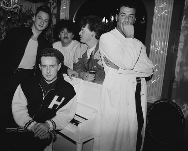 Frankie Goes To Hollywood in 1986. Singer Holly Johnson is seated by the piano, and behind him are (left to right) bassist Mark O’Toole, drummer Peter Gill, guitarist Brian Nash and singer Paul Rutherford. 
