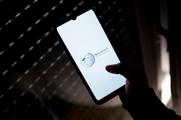 Wikipedia may restrict its access to UK readers after it refuses to carry out age verification if required by the government’s online safety bill. (Photo by Nikolas Kokovlis/NurPhoto via Getty Images)