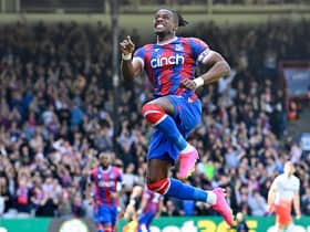 Crystal Palace’s Ivorian striker Wilfried Zaha celebrates after scoring their second goal  (Photo by JUSTIN TALLIS/AFP via Getty Images)