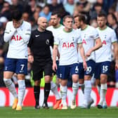 Son Heung-Min of Tottenham Hotspur and teammates look dejected after Liverpool score three during the Premier League match between Liverpool FC and Tottenham Hotspur