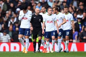 Son Heung-Min of Tottenham Hotspur and teammates look dejected after Liverpool score three during the Premier League match between Liverpool FC and Tottenham Hotspur