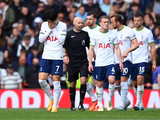 Son Heung-Min of Tottenham Hotspur and teammates look dejected after Liverpool score three during the Premier League match between Liverpool FC and Tottenham Hotspur