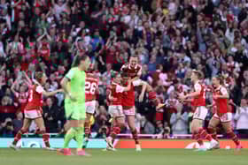 The players celebrate Jen Beattie’s late equaliser against Wolfsburg. (Photo by Richard Heathcote/Getty Images)