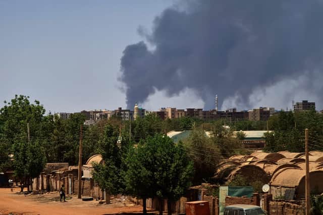Smoke billows over buildings in Khartoum on May 1, 2023